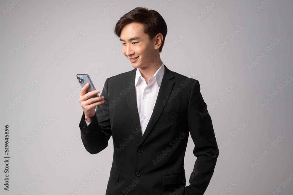Young businessman wearing suit over white background studio Young businessman wearing suit over white background studio