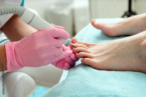 Pedicure procedure.Close up hands.Foot care.Using tools.