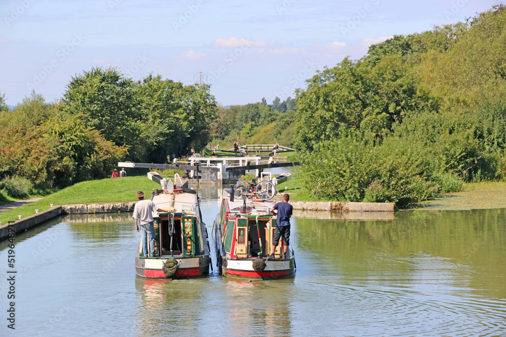 Naklejka premium Narrow boats in the Caen Hill canal locks, Devizes, England