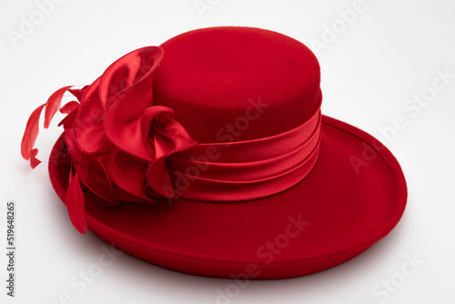 Studio photo of a red vintage hat. The background is white.