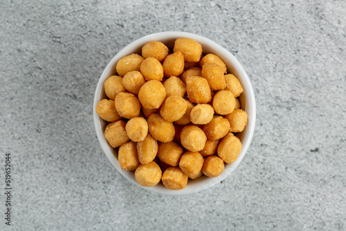 Photos Snacks in ramekin on the table.