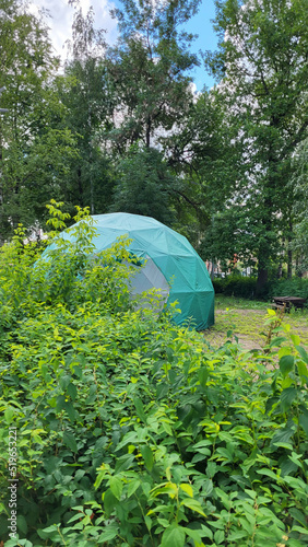 Large green dome geodesic tent for camping. Tourism concept