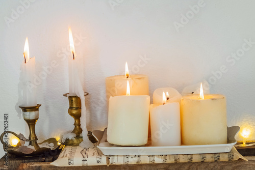 Cozy Christmas rustic home decoration with candles. vintage style new year interior.