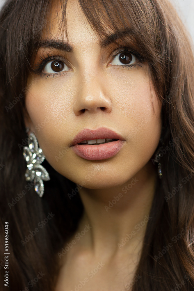 Beautiful model woman face with green eyes and perfect makeup