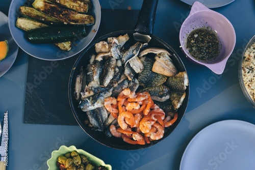 delicious fresh fish seafood and shrimps from the ardeche in France served with grilled vegetables. Prepared with garlic and good olive oil