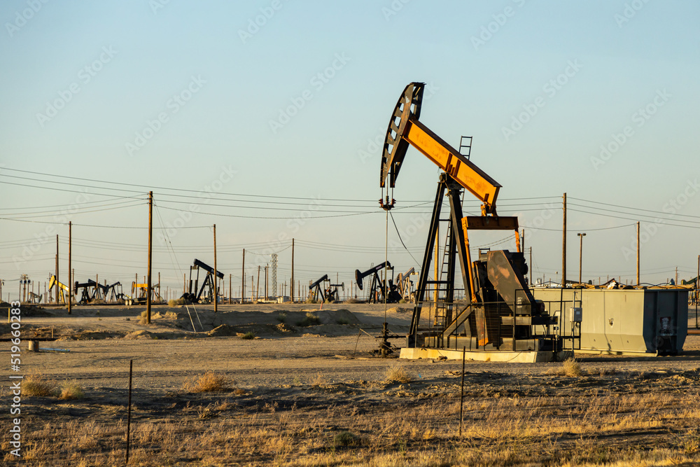 Pump jack in large oil field