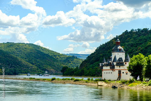 castle on the lake near Frankfurt and Hesse region on a sunny day. Riverside castle in Germany with blue sky above