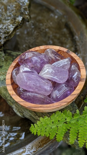 Amethyst Crystals in a wood bowl  photo