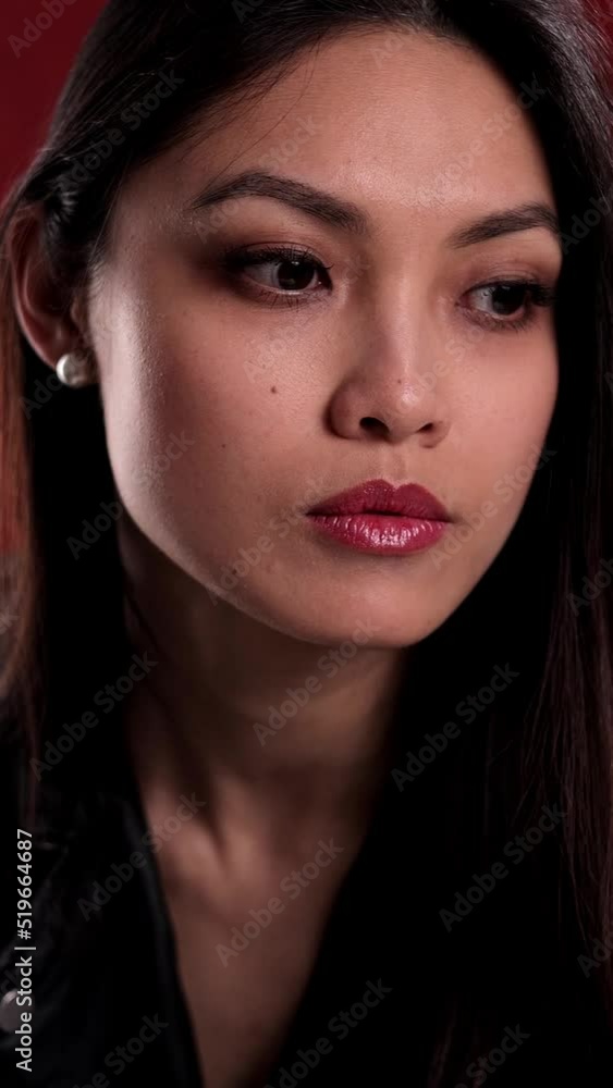 Young and pretty woman looks thoughtful - studio shooting Young and pretty woman looks thoughtful - studio shooting