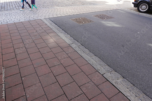 A paved sidewalk in a city street