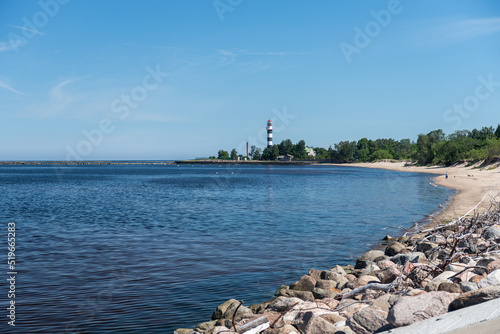 Daugavgriva lighthouse on a sunny summer day, Latvia. photo