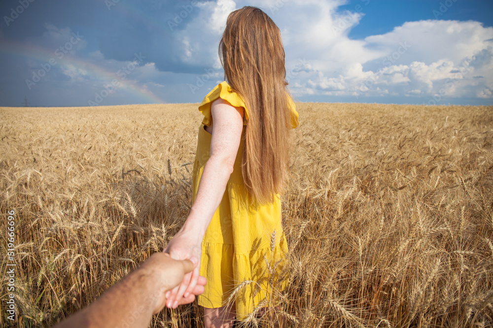 Young red-haired woman holding her boyfriends hand Young red-haired woman holding her boyfriends hand