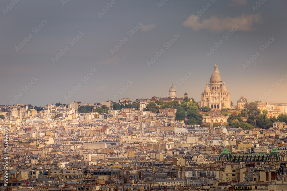 Parisian roofs of Montparnasse and Montmartre at sunrise Paris, France