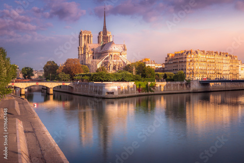 Fototapeta Notre Dame of Paris on Seine River reflection at sunrise, France