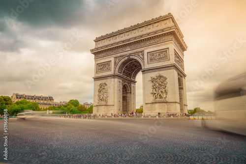 Triumphal Arch in Charles de Gaulle square with blurred cars, Paris © Aide