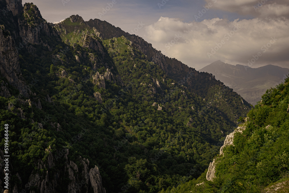Fototapeta premium Beautiful landscape in mountains with clouds in Italy