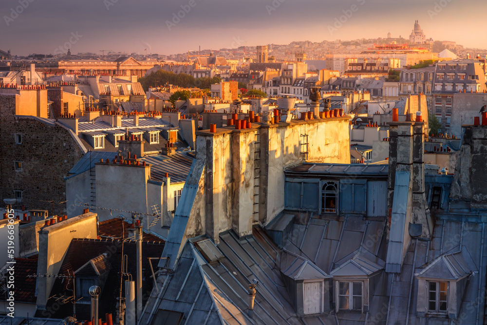 Parisian roofs of Montparnasse and Montmartre at sunset Paris, France