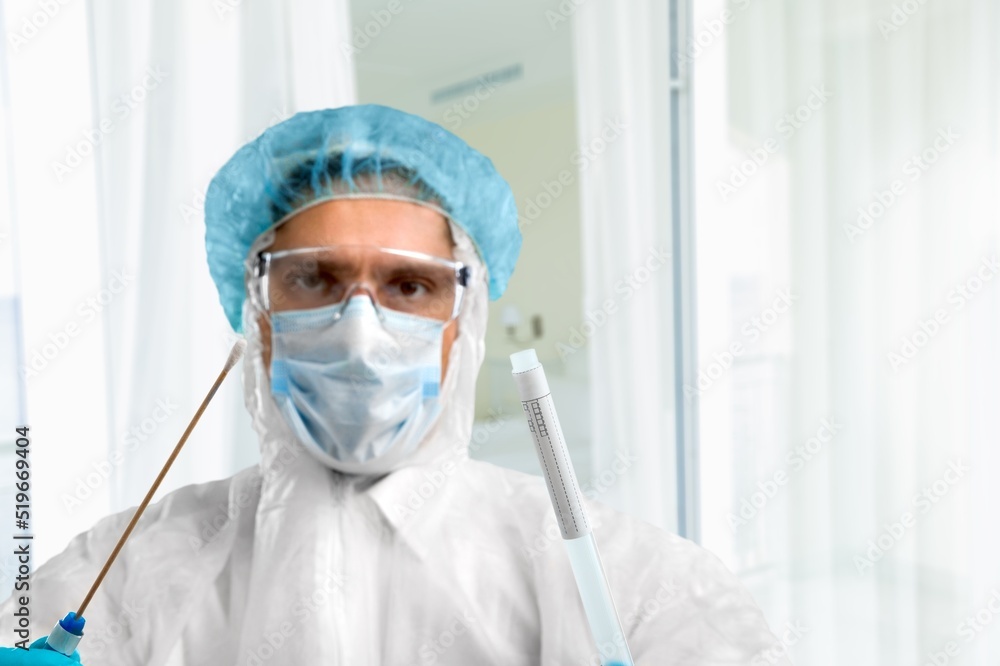 A medical worker holds a test tube with Monkeypox virus infected sample. Epidemic of smallpox monkeys in Europe and the USA. A medical worker holds a test tube with Monkeypox virus infected sample. Epidemic of smallpox monkeys in Europe and the USA.