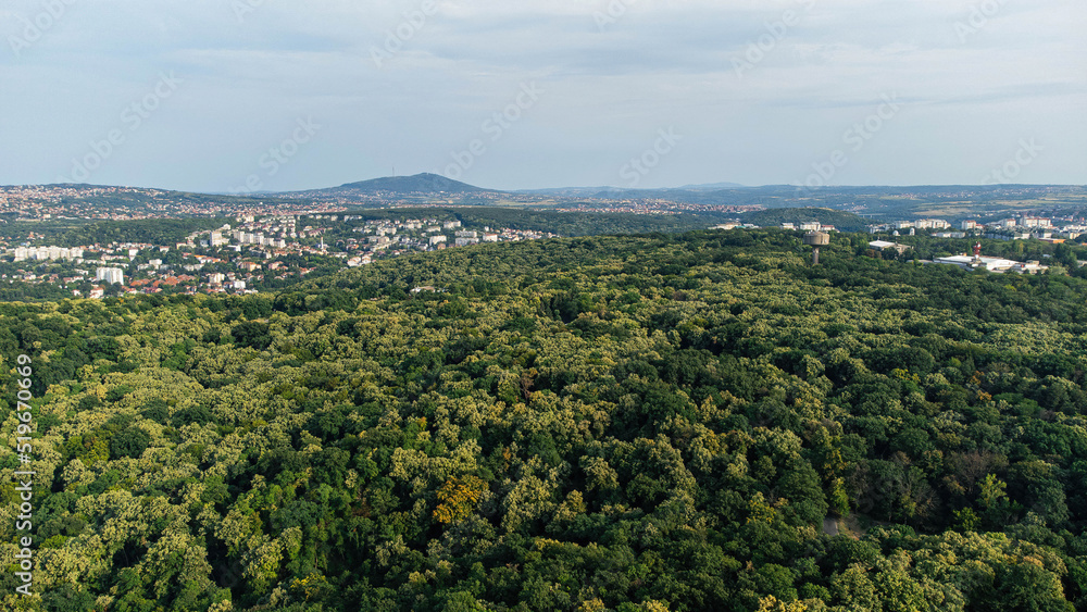 Belgrade, Serbia, 07.27.2022 Aerial photo of the forest in Belgrade Serbia taken from above with drone during summer month of July Avala mountain in distance