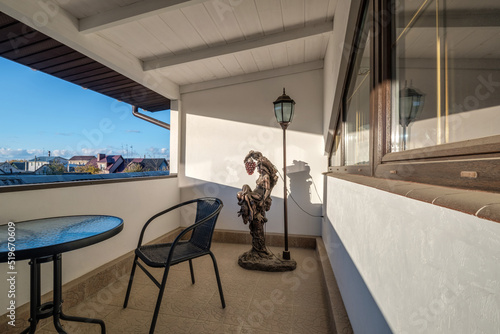 furniture on the balcony in bright interior photo