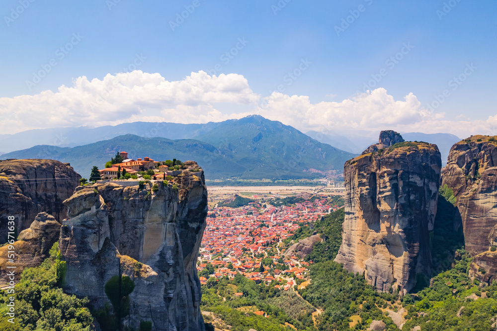 The city of Kalabaka and famous monasteries on the tops of stone pillars in Meteora. Panoramic aerial view. High quality photo