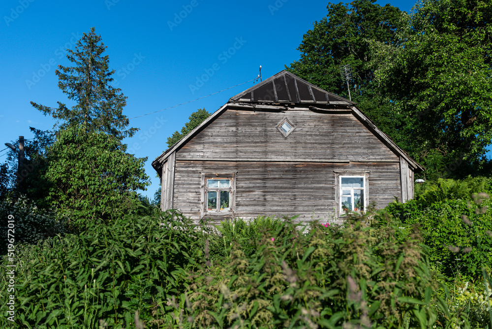 Old wooden house with very beautiful old wooden window in Subate, Latvia. Old wooden house with very beautiful old wooden window in Subate, Latvia.