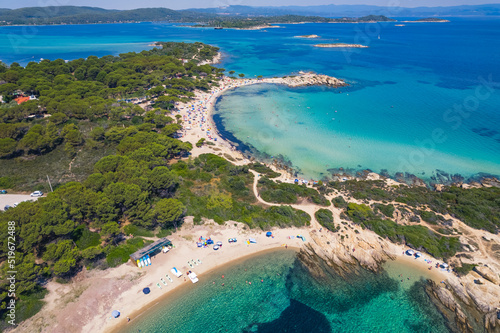 Karydi Beach seen from aerial drone view. Amazing natural water colors - turquoise and dark blue. Sunny weather. High quality photo