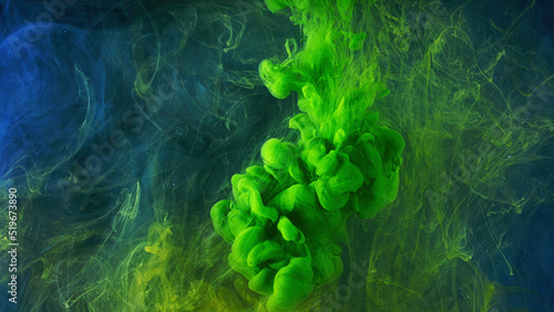 Canvas Print A beautiful mixture of acrylic inks in dark blue glittering water