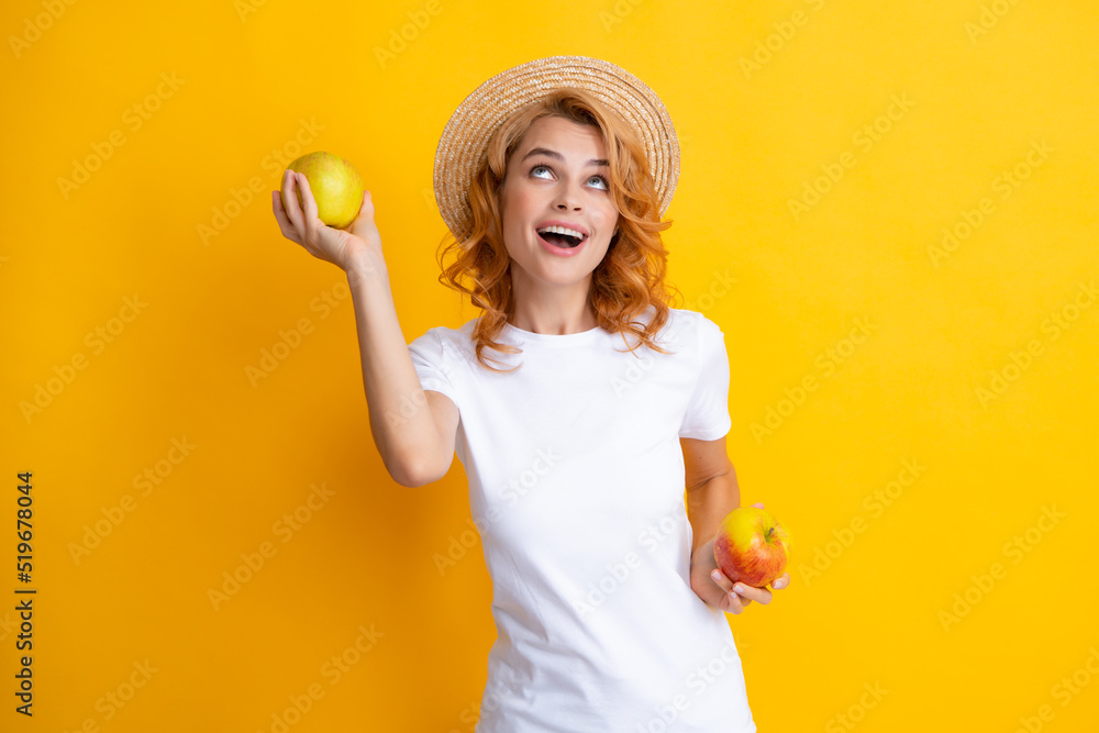 Portrait of a smiling happy girl with apple isolated over yellow background. Portrait of a smiling happy girl with apple isolated over yellow background.