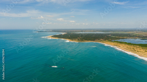Tropical landscape of the island of Sri Lanka with beaches, ocean and agricultural land.