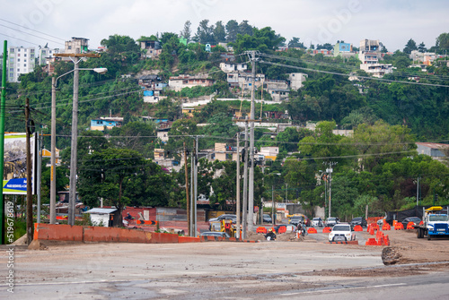 Guatemala – September 01, 2019. Construction of an overpass called four roads in front of a populated area of Guatemala City, vehicle traffic ordinance.