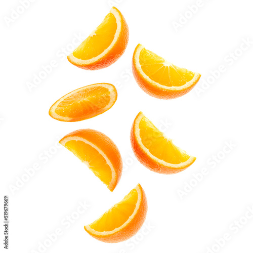 Fototapeta falling fresh orange fruit slices isolated over white background closeup