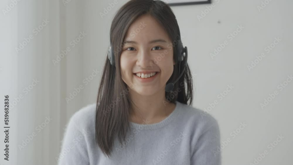 Young asian businesswoman wearing headset video call and presentation for conference online at home, woman meeting and talking for present, one person, business and communication concept. Young asian businesswoman wearing headset video call and presentation for conference online at home, woman meeting and talking for present, one person, business and communication concept.