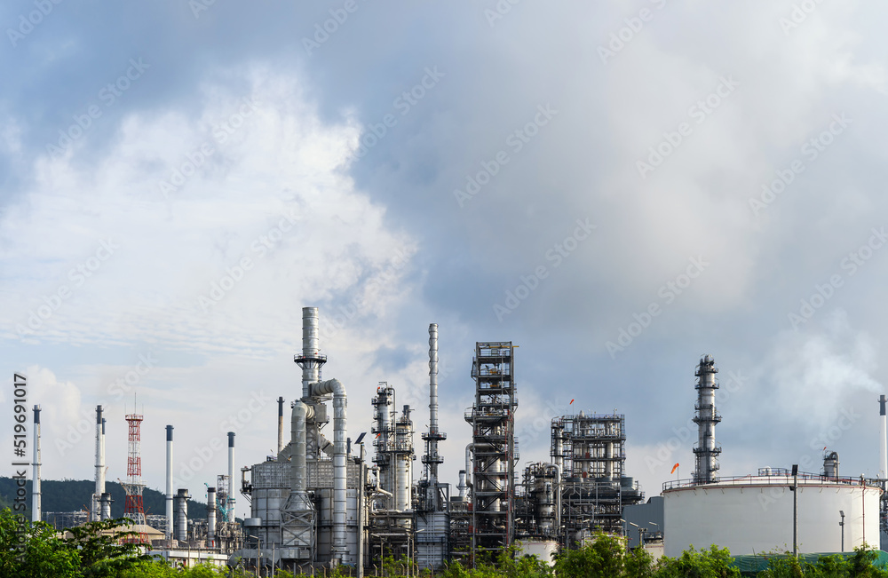 Oil and gas refinery plant and storage tank form industry zone with Air pollution smoke, Oil and gas Industrial petrochemical fuel power and energy. Refinery factory.