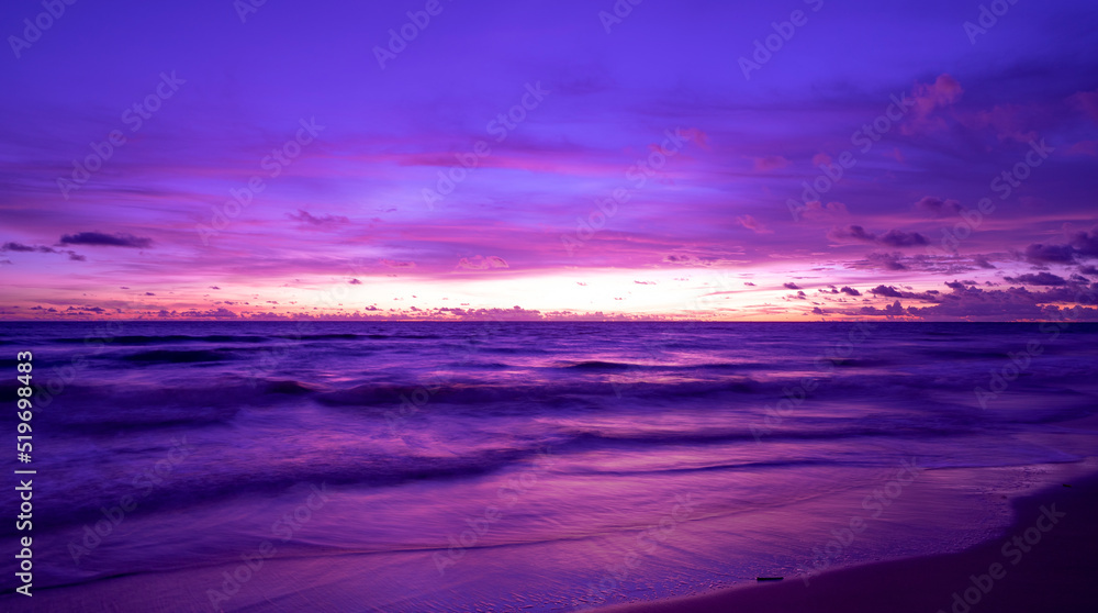 Cyberpunk color trend popular background.Nature beautiful Light Sunset or sunrise over sea Colorful dramatic majestic scenery Sky with Amazing clouds and waves in sunset sky purple light cloud