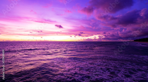 Cyberpunk color trend popular background. Nature beautiful Light Sunset or sunrise over sea Colorful dramatic majestic scenery Sky with Amazing clouds and waves in sunset sky purple light cloud 