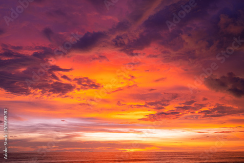 Nature beautiful Light Sunset or sunrise over sea Colorful dramatic majestic scenery Sky with Amazing clouds and waves in sunset sky golden light cloud © panya99