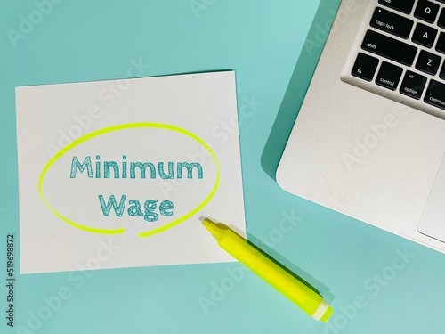 minimum wage text on blue background photo