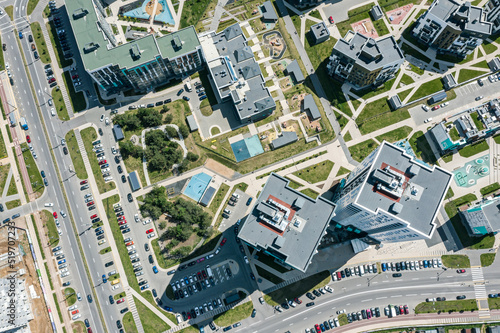 aerial top view of residential buildings with children playgrounds in courtyard