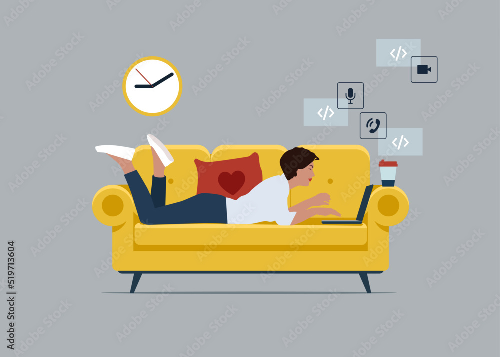 Young businessman character lying on the sofa and typing on a laptop, working from home concept.