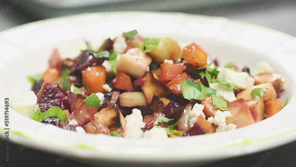Roasted root vegetables salad, served in a plate.
Roasted root vegetables salad, served in a plate.