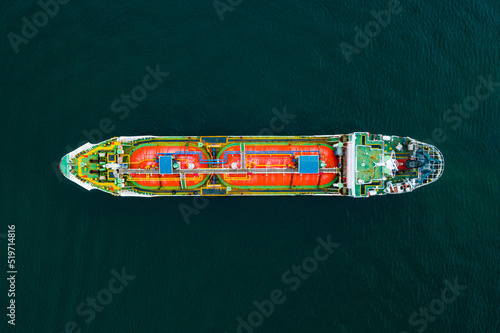 Aerial view of Crude oil tanker or Gas LPG tanker container ship at sea schelde at sunset. Oil cargo tanker cruising gulf of Thailand deep blue sea, Thailand © AU USAnakul+