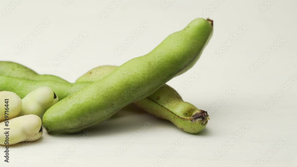 Fresh broad beans on a solid color background Fresh broad beans on a solid color background