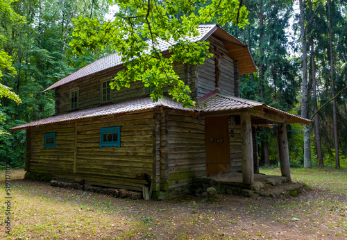 Old medieval wooden building church in the forest. 25 july 2022, Minsk, Belarus
