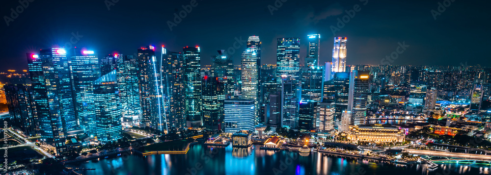 Fototapeta premium Singapore city skyline with modern skyscraper architecture building for concept of financial business and travel in Asia cityscape urban landmark, marina bay at night district dusk sky