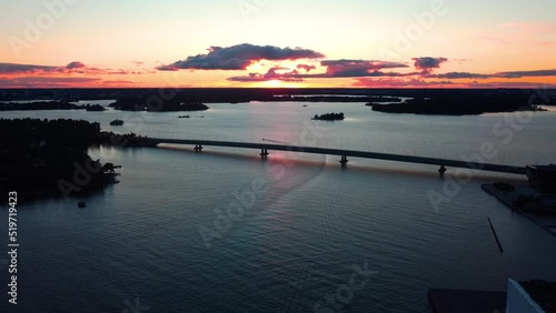 Aerial view overlooking the silhouettte Lapinlahti bridge, in Helsinki, sunset in Finland photo