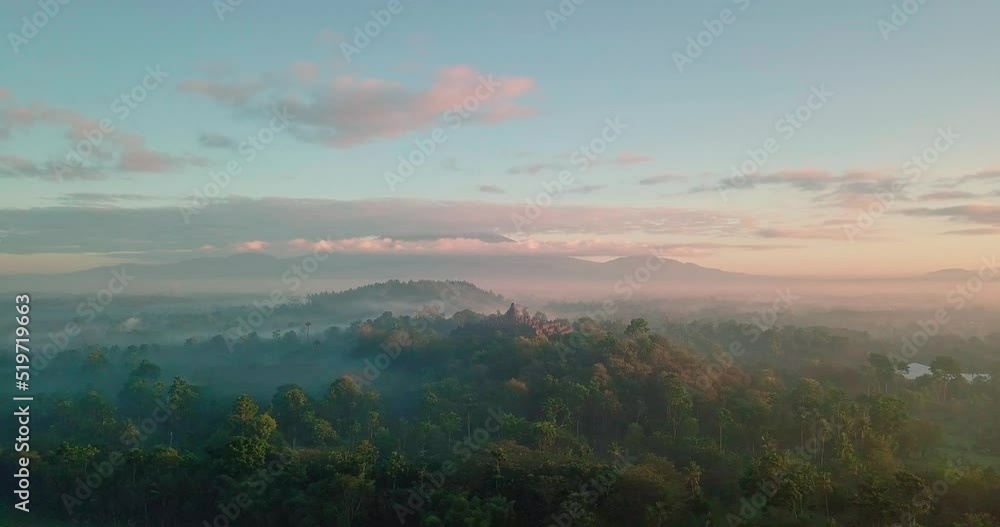 Aerial orbit shot of mysterious Borobudur Temple in Central Java - It is the world's largest Buddhist temple. Aerial orbit shot of mysterious Borobudur Temple in Central Java - It is the world's largest Buddhist temple.