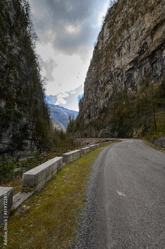 Mountain road with steep cliffs. Beautiful road landscape