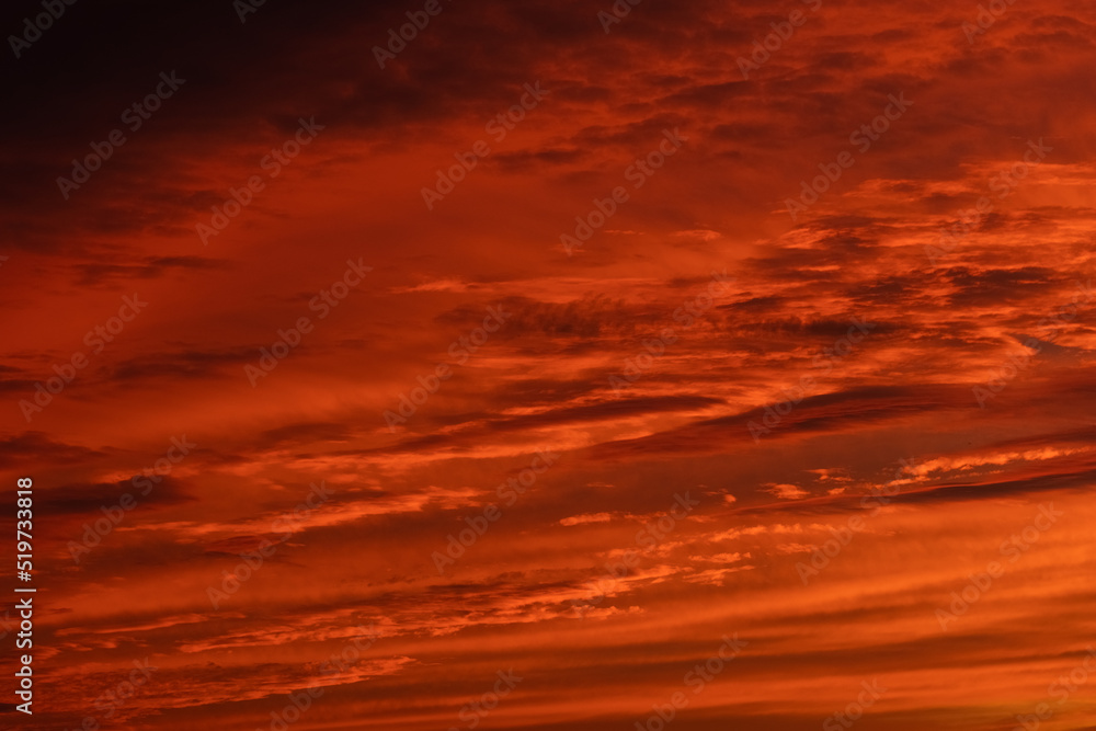 Orange and red sky at sunset and dawn. structure and texture of clouds. different shapes and types of sky. Photo and wallpaper on the desktop. beautiful transfusion of colors and smooth transition.