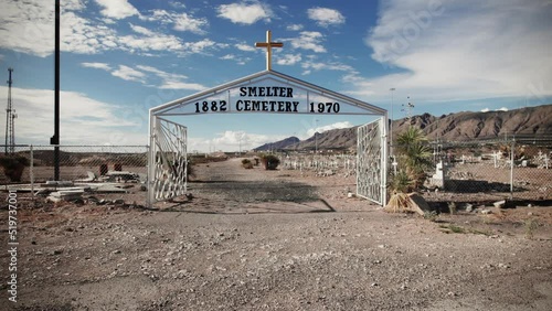 Dollying in through the gates of an old desert cemetery in El Paso Texas - 1882-1970 photo